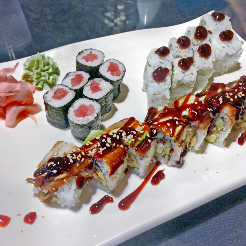 A sushi plate at Asahi: Dragon roll, tuna roll and AAC roll.