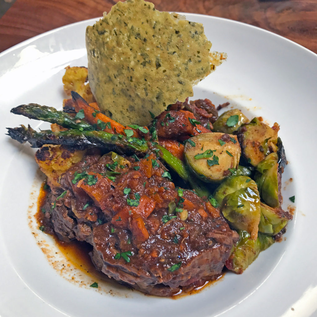 Short ribs, one of the “Hearty Plates” at Noosh Nosh.