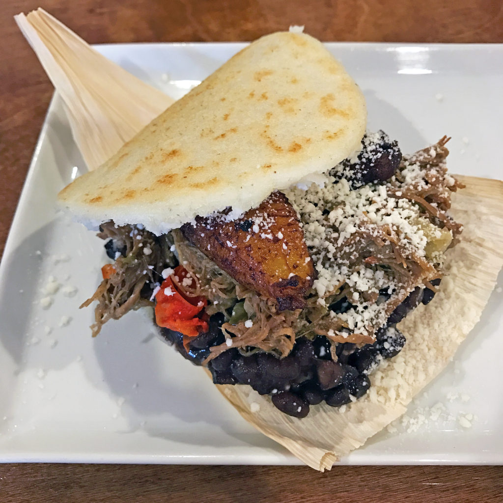 A pabellon arepa stuffed with shredded beef, an iconic Venezuelan dish at Nahyla’s.
