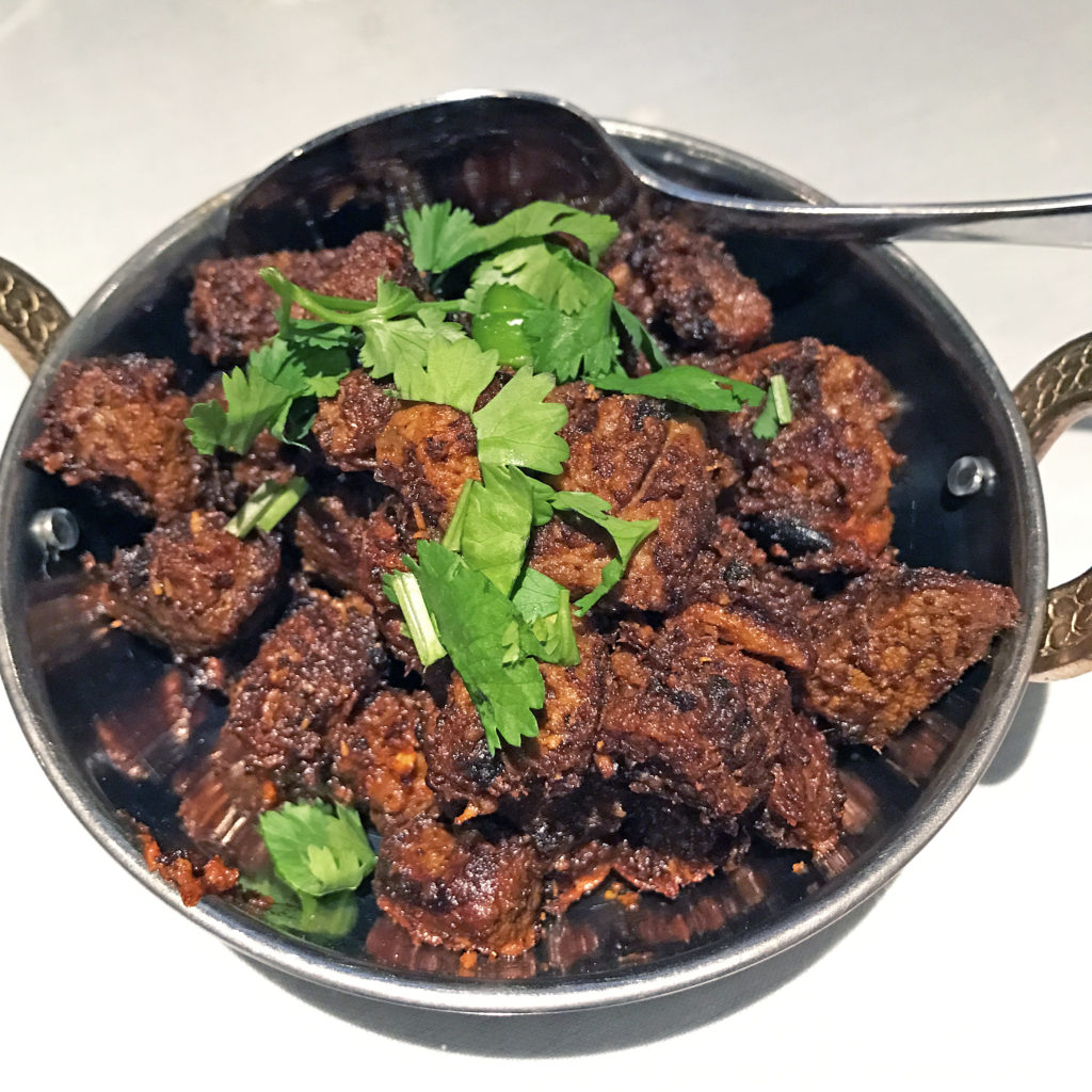 Tikka House’s dry curry of roast lamb with coconut.