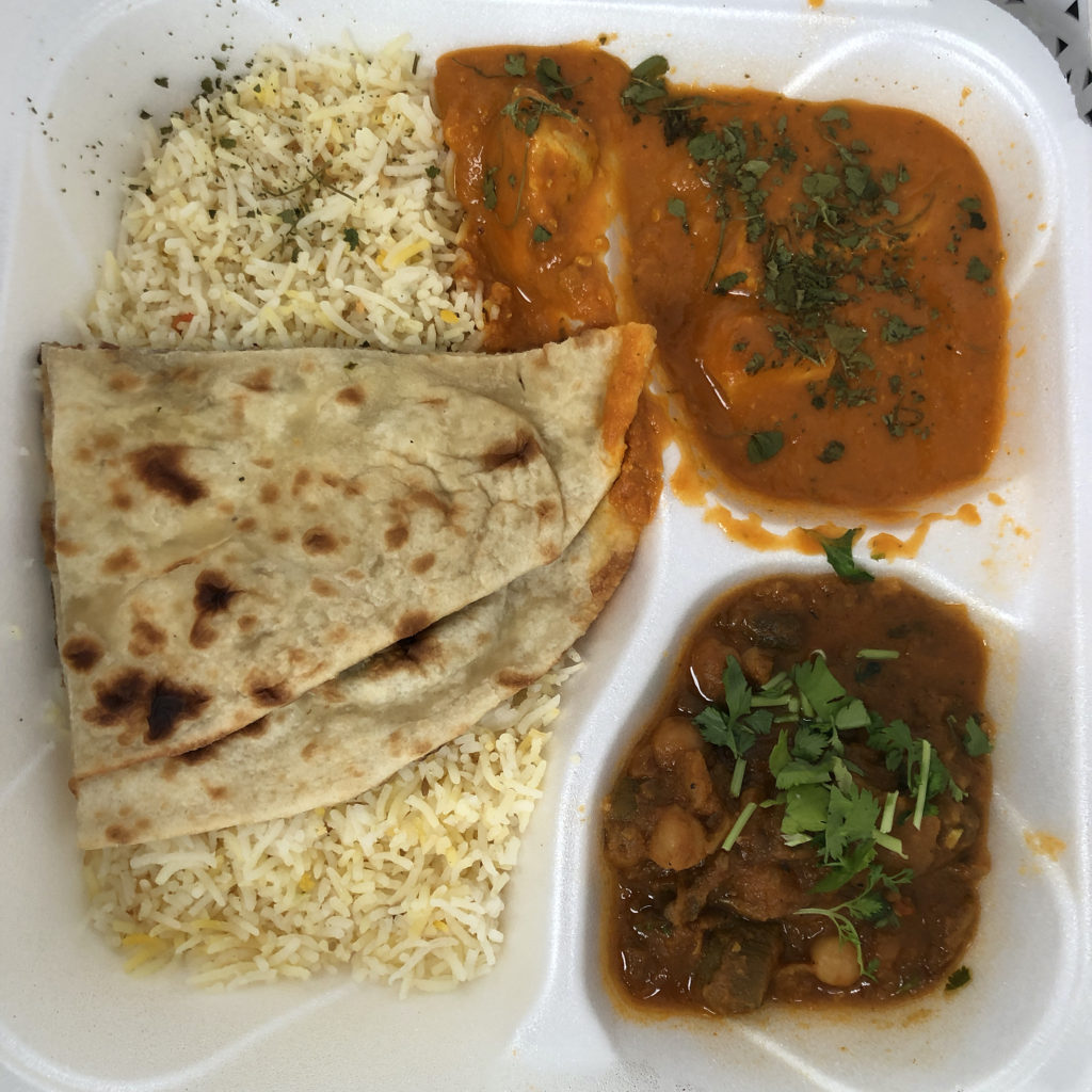 The free chicken tikka lunch includes chicken, veggie masala, naan bread and rice.