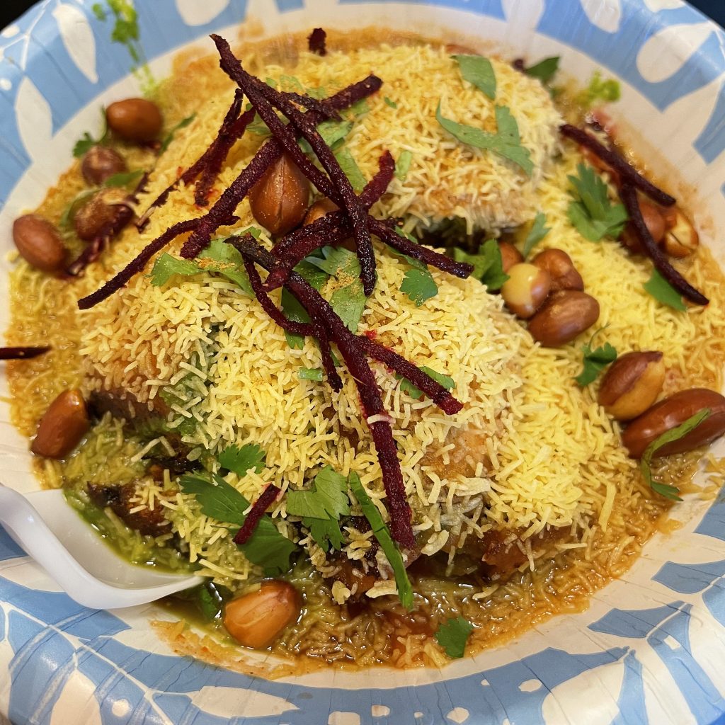 Dabeli chaat was a spicy, fruity, and filling potato snack topped with peanuts and crunchy sev noodles.