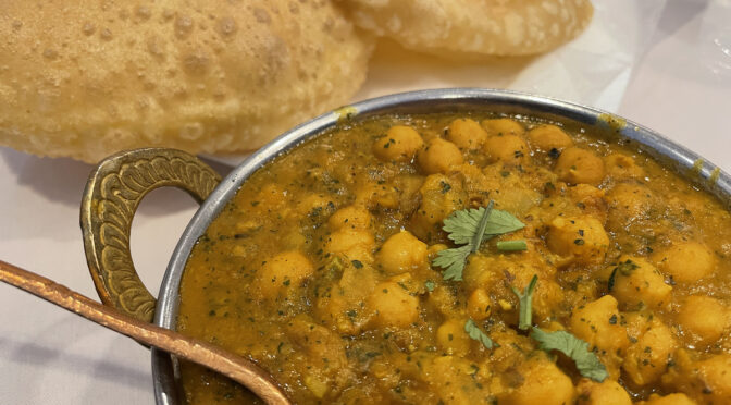 Chickpea chana masala and puffy puri bread at Shalimar.